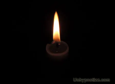 Candle in the dark as seen from slightly above. This makes a great focal point when meditating.