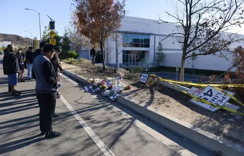 The (now) memorial site of where Paul Walker and Roger Rodas supposedly crashed and died. Notice the carefully placed speed limit sign on the ground (45 mph) as well as the sharp turn ahead (15 mph) sign. Also note that this is in front of the headquarters for Hypercel, a cell phone accessory company.