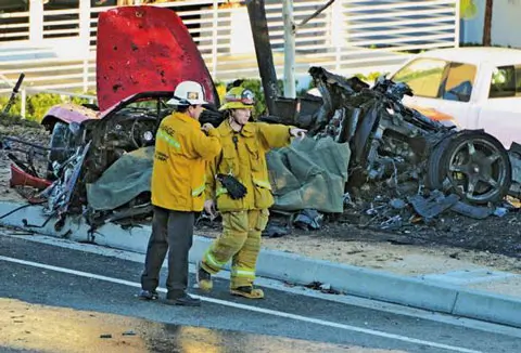 The unnaturally twisted remains of what used to be a Porsche Carrera GT, supposedly crashed and burnt. Paul Walker was supposedly the passenger and Roger Rodas the driver in this horrific wreck.