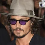 Image of Johnny Depp with hat and sunglasses, similar to the image in the vision I had about his death by suicide.