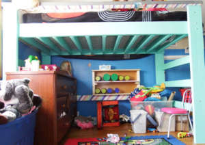 Loft Bed #2, which was built for our youngest daughter. Notice the rainbow designs on both the underside of the railing and the support bar.