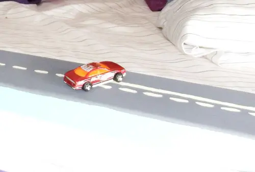 Road railing on bed #1. Lines on road include dotted line, solid and dotted line, and double solid lines, for teaching passing rules on road.